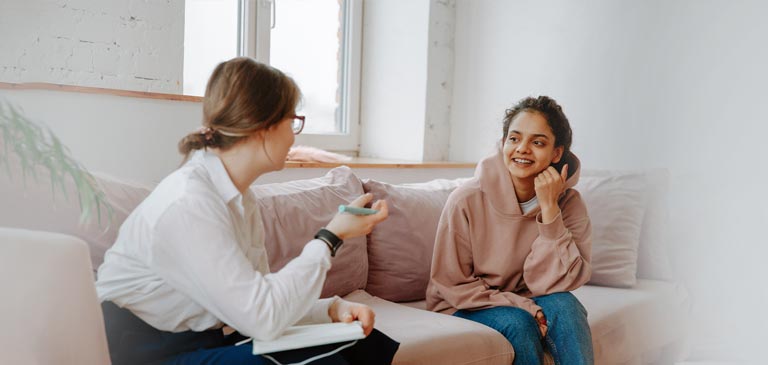 Social worker having a friendly conversation with a client