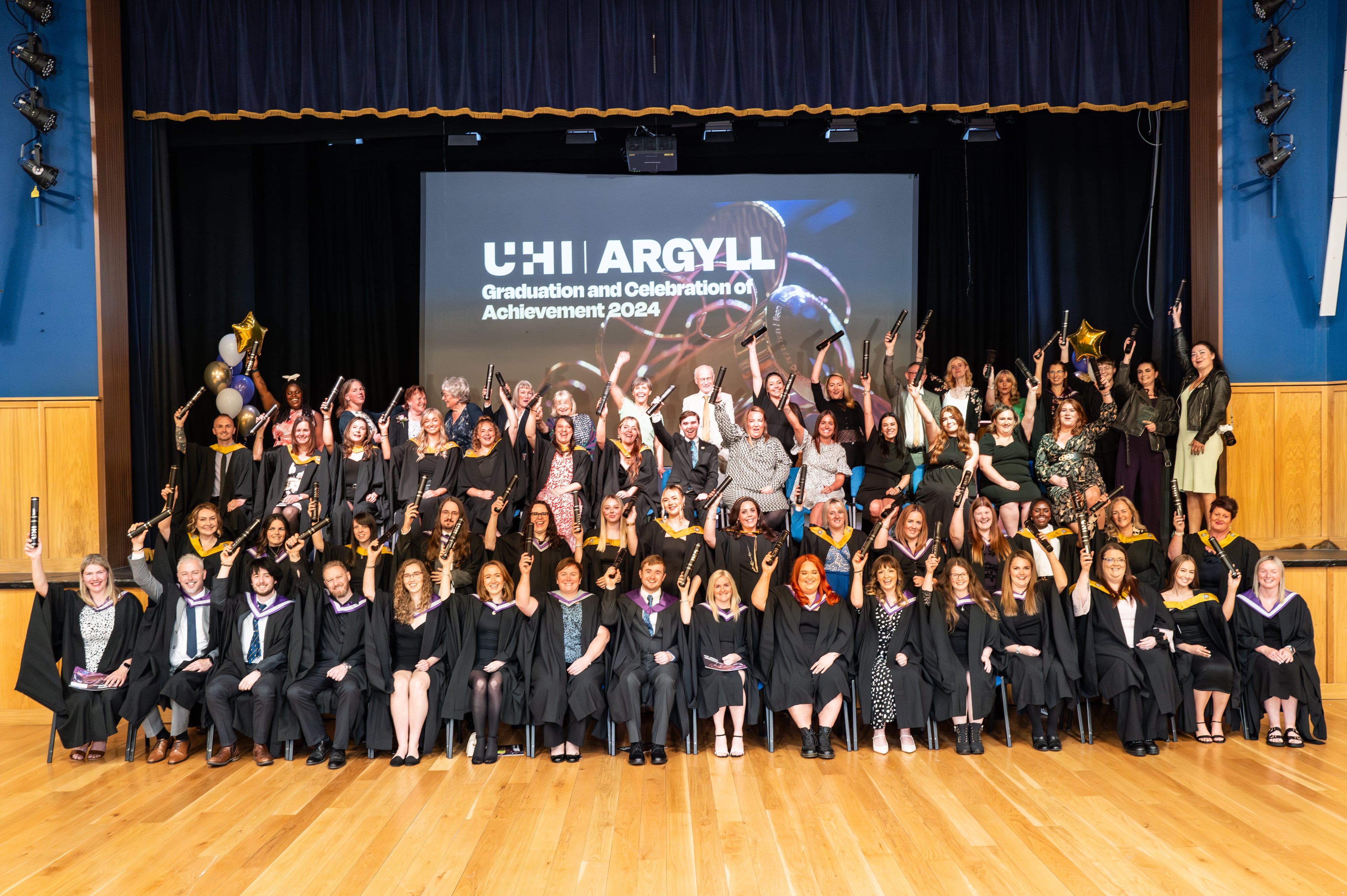 The class of 2024 on stage at the Queen's Hall, Dunoon